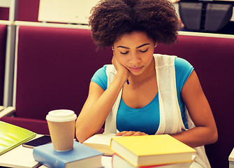 Image showing student girl with books and coffee on lecture