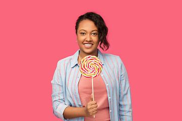 Image showing happy african american woman with big lollipop