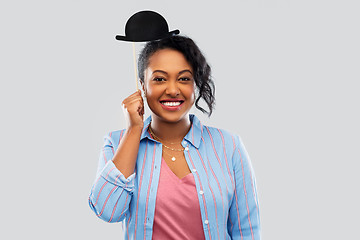 Image showing african woman with bowler hat party accessory