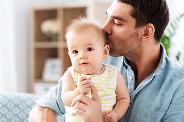 Image showing father kissing little baby daughter