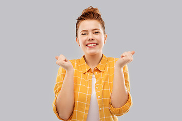 Image showing happy red haired teenage girl celebrating success