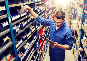 Image showing auto mechanic or smith with tablet pc at workshop