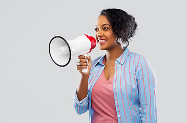 Image showing happy african american woman over grey background