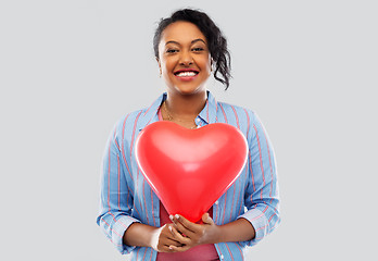 Image showing african american woman with heart-shaped balloon