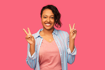 Image showing happy african american woman showing peace