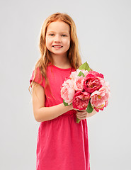 Image showing happy red haired girl with flowers