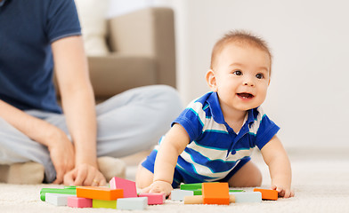 Image showing baby boy with father playing toy blocks at home