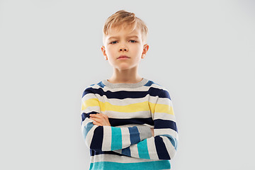 Image showing little boy in striped pullover with crossed arms