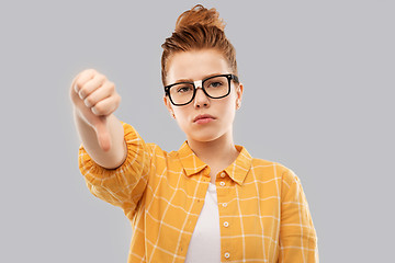 Image showing red student girl in glasses showing thumbs down