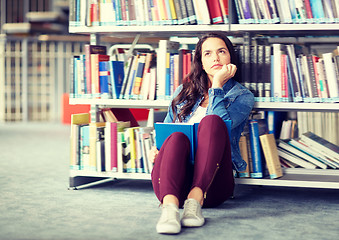 Image showing high school student girl reading book at library