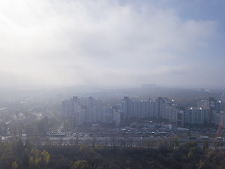 Image showing Foggy morning above city district.