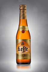 Image showing UKRAINE, KYIV - APRIL 6, 2013. Bottle of Leffe Blond beer on a gray background.