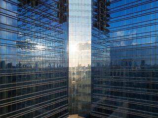 Image showing Reflection on a glass facade of office building