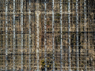 Image showing Metal framework of greenhouses on a ground of drone view.