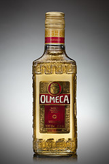 Image showing UKRAINE, KYIV-DECEMBER 12, 2012. Olmeca Tequila Cold bottle from Jalisco, Mexico on a gray background.