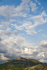 Image showing Blue sky with clouds and mountains in a summer day.