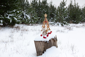 Image showing Christmas tree and Christmas decorations in snowy landscape