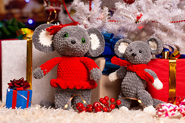 Image showing Two homemade plush mice under the Christmas tree with gifts