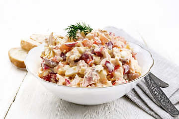 Image showing Salad with chicken and vegetables in plate on wooden board