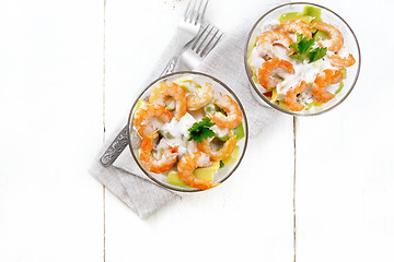 Image showing Salad with shrimp and avocado in two glasses on table top