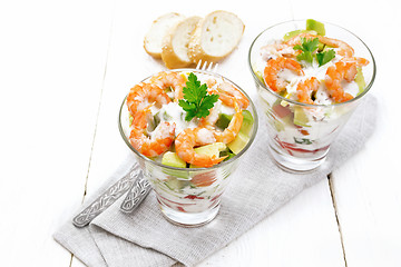 Image showing Salad with shrimp and avocado in two glasses on white board