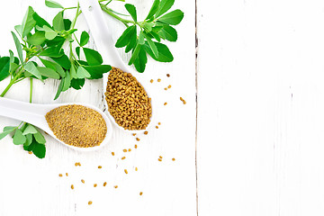 Image showing Fenugreek in two spoons with leaves on board top