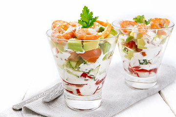 Image showing Salad with shrimp and avocado in two glasses on table