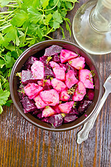 Image showing Salad of beets and potatoes in bowl on board top