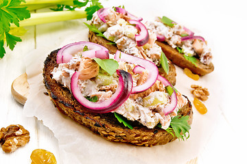 Image showing Bruschetta with fish and curd on board