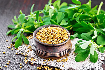 Image showing Fenugreek in bowl with leaves on board