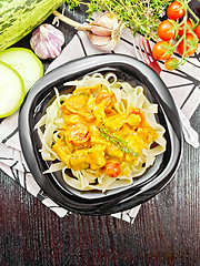 Image showing Pasta with goulash in plate on dark board top