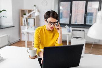 Image showing businesswoman with laptop and coffee at office