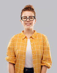 Image showing smiling red haired teenage student girl in glasses