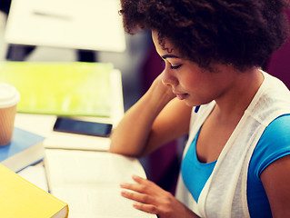 Image showing student girl with books and coffee on lecture