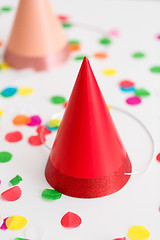 Image showing red birthday party cap and confetti