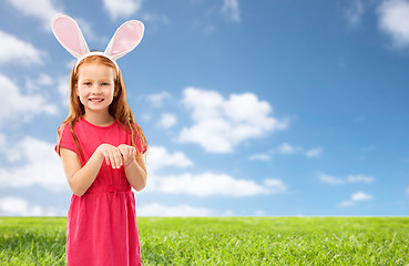 Image showing happy red haired girl wearing easter bunny ears