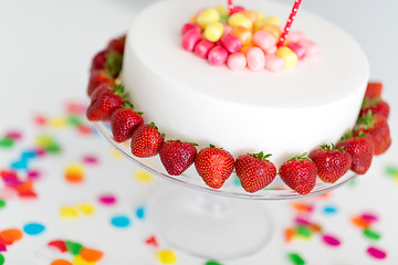 Image showing close up of birthday cake with strawberries