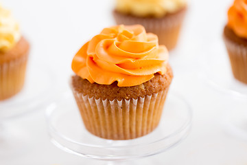 Image showing cupcake with frosting on confectionery stand