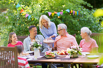 Image showing happy family having dinner or summer garden party