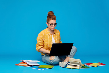 Image showing redhead teenage student girl with laptop and books
