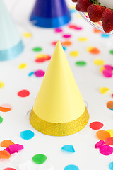 Image showing yellow birthday party cap and confetti