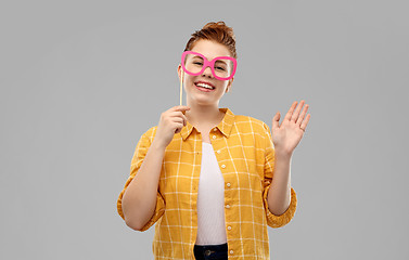 Image showing smiling red haired teenage girl with big glasses