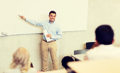 Image showing group of students and teacher on lecture