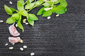 Image showing Frame of ingredients for pesto sauce on black board