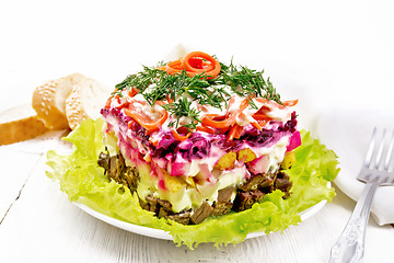 Image showing Salad with beef and vegetables on light wooden table