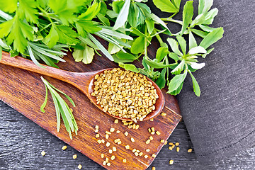 Image showing Fenugreek in spoon with herbs on board top