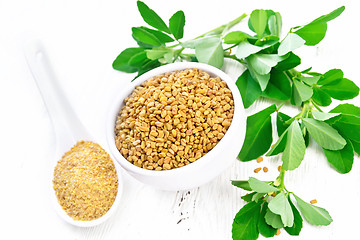 Image showing Fenugreek in bowl and spoon with leaves on board