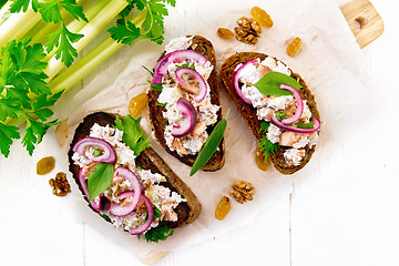 Image showing Bruschetta with fish and curd on light board top