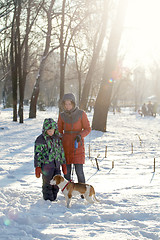 Image showing Boy His Mother And Dog