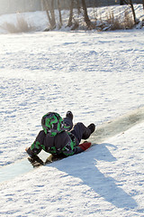 Image showing Boy Sliding on Ice Rink